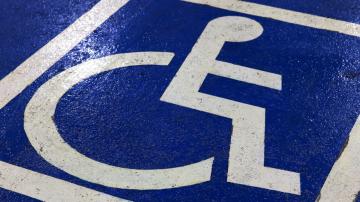 Parking space with painted blue and white handicap icon